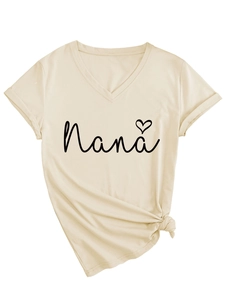 Detail of Nana heart print and decorative knot hem on a beige V-neck short sleeve T-shirt