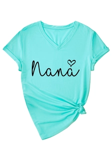 Detail of Nana heart print on mint green V-neck T-shirt with knotted hem style