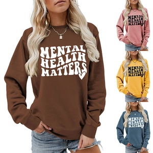 Detail view of long-sleeve crewneck sweatshirts in four colors with Mental Health Matters print