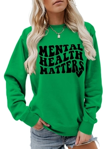 Detail of Mental Health Matters text printed on a lime green crewneck sweatshirt