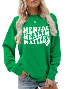 Detailed close-up of bright green Mental Health Matters sweatshirt with white graphic print