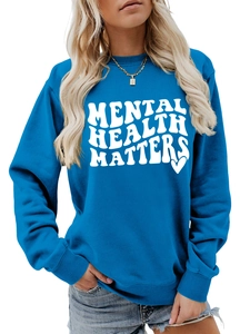 Close-up of Mental Health Matters lettering on a royal blue crewneck sweatshirt
