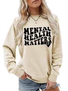 Detail of Mental Health Matters text print on beige long sleeve crewneck sweatshirt