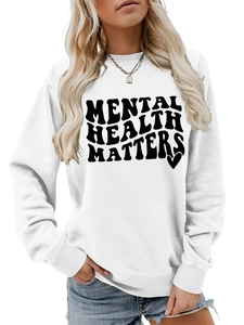 Close-up of the Mental Health Matters print and heart graphic on a white cotton sweatshirt