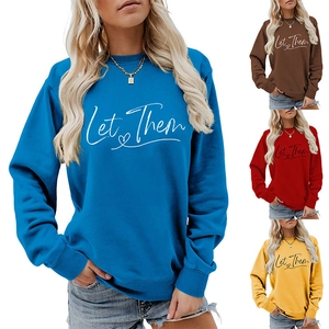 Detail of Let Them lettering and heart print on colorful long sleeve sweatshirts