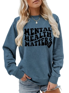 Detail of navy sweatshirt featuring Mental Health Matters wavy text and heart graphic