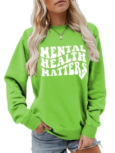 Detail of Mental Health Matters slogan printed on a green long sleeve sweatshirt