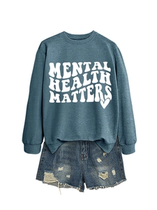 Detail of Mental Health Matters text print on a dark blue sweatshirt with denim shorts