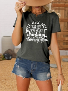 Detail of grey casual T-shirt featuring well well well white slogan print and cotton texture