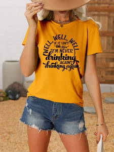 Close-up of bright yellow cotton t-shirt with slogan print and denim shorts outfit