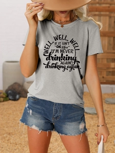 Detail of grey crewneck T-shirt with Well Well Well text print paired with denim shorts