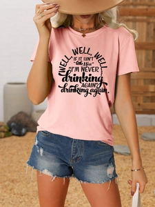 Pink cotton t-shirt with well well well text print paired with denim shorts for summer