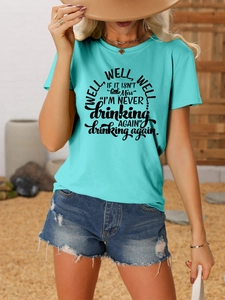 Detail of casual t-shirt with funny quote paired with distressed denim shorts outdoors
