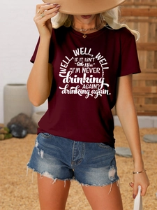 Close-up of funny quote print on burgundy cotton T-shirt with vintage casual styling