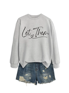 Detail of grey Let Them sweatshirt and blue distressed denim shorts set on white background