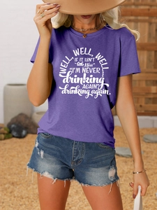 Detail of purple cotton blend T-shirt with well well well if it slogan and denim shorts