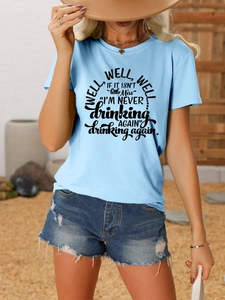 Detail of light blue cotton T-shirt featuring vintage black graphic text print