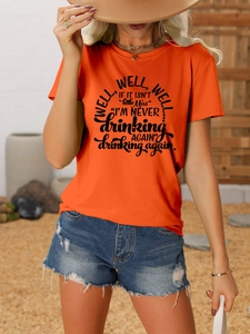 Detail of orange cotton crew neck t-shirt featuring black well well well art print