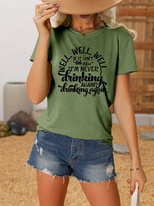 Detail of green vintage t-shirt featuring artistic text and high-quality knit texture