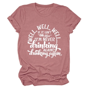 Detail of dusty pink crew neck T-shirt with vintage white Well well well text print