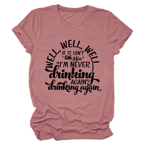 Detail of dusty pink T-shirt with black Well Well Well slogan and rolled cuff sleeves