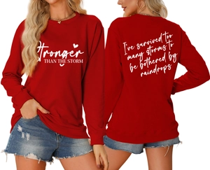 Detailed front and back view of red crewneck sweatshirt with white motivational lettering
