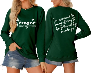 Front and back view of dark green sweatshirt with Stronger Than The Storm lettering
