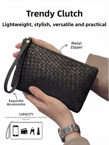 Macro detail of men's woven black leather clutch showing large capacity and zipper