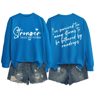 Flat lay of royal blue sweatshirt showing both front and back motivational prints