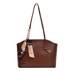 Dark brown crocodile embossed tote bag with printed silk scarf and knotted shoulder strap