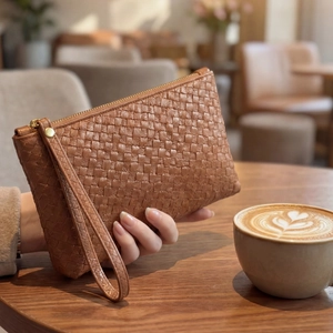 Brown woven leather oversized envelope clutch with gold zipper and wristlet strap