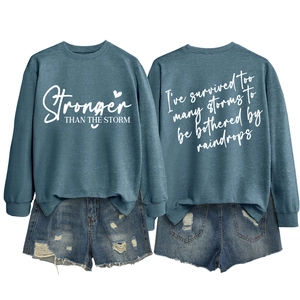 Front and back view of blue oversized crewneck sweatshirt with motivational print
