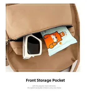 Detailed view of water-resistant nylon backpack front zipper pocket with sunglasses