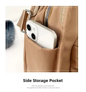 Close-up of side pocket on brown nylon shoulder bag showing phone storage capacity