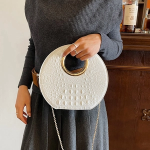 Elegant white crocodile pattern cloud bag with gold circular handle and chain strap