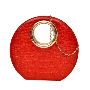 Elegant red crocodile texture handbag with gold circular metal handle and chain strap