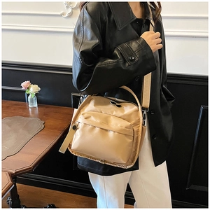 Close-up of khaki waterproof oxford fabric crossbody bag with wide shoulder strap