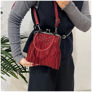 Red retro fringe shoulder bag with metal rivets and vintage doctor bag clasp closure