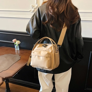 Beige nylon multi-layer crossbody bag with wide strap and handle for casual wear