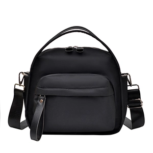 Multi-layer black nylon crossbody bag with adjustable strap and top handle for women