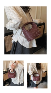 Detail of burgundy woven shoulder bag featuring contrast hand-stitching and litchi texture
