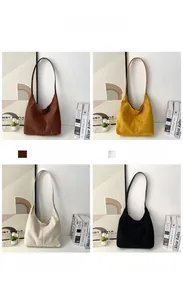 Detail view of corduroy texture shoulder bags in brown, yellow, white and black colors