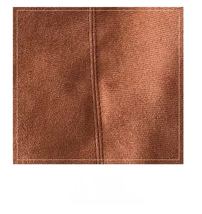 Close-up of brown suede fabric texture with detailed vertical double-line stitching