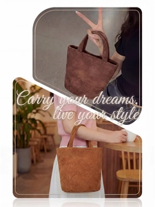 Detailed view of suede tote bags in dark coffee and warm camel for a minimalist aesthetic