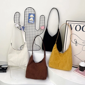 Minimalist hobo shoulder bags in suede finish featuring four vintage colors on white steps