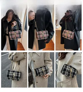 Macro view of retro plaid tweed crossbody bag with gold chain and letter charm