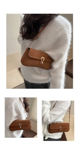 Detail of caramel shoulder bag featuring a gold horseshoe buckle and magnetic flap closure