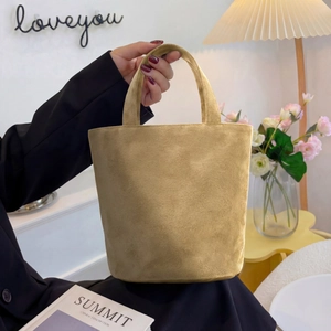 Minimalist large capacity suede tote bag in brown shown in a lifestyle home setting