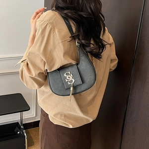 Chic black PU hobo shoulder bag with golden SS logo and elegant tassel detail