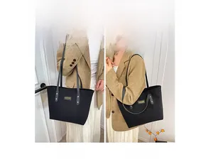 Detail showing various carrying styles of the large capacity black corduroy tote bag